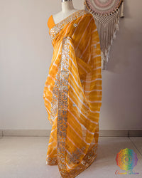 Mustard Orange Organza Leheria Saree with Kachha Gota Handwork – Side Drape highlighting the lightweight Organza fabric, flowing Leheria design and traditional Gota embellishment