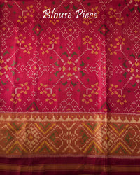 Matching red blouse piece in pure mulberry silk fabric with Patola woven detailing