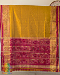 Open palla view of mustard Rajkot Patola pure mulberry silk saree displaying red palla and woven design