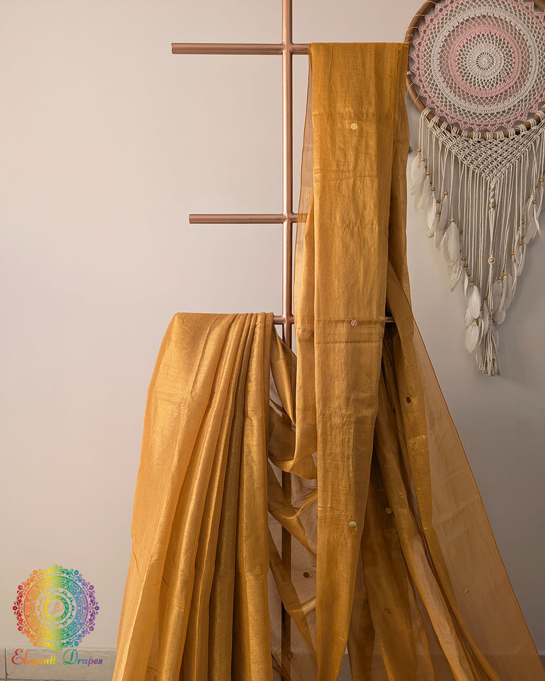 Close up of mustard yellow Bengal mul tissue saree with sequins work