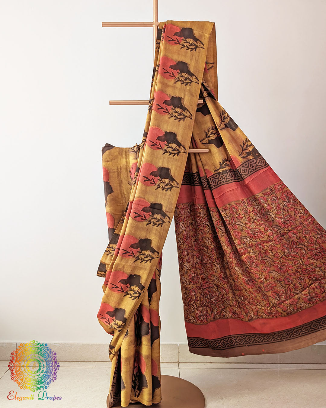Yellow Nashpal Pomegranate Ajrakh Modal Tussar Silk Saree with the palla neatly pleated, highlighting the layered fabric and traditional Nashpal Pomegranate Ajrakh detailing.
