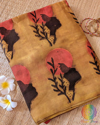 Yellow Nashpal Pomegranate Ajrakh Modal Tussar Silk Saree folded to display its bright yellow shade, pomegranate Ajrakh print and distinctive striped design.