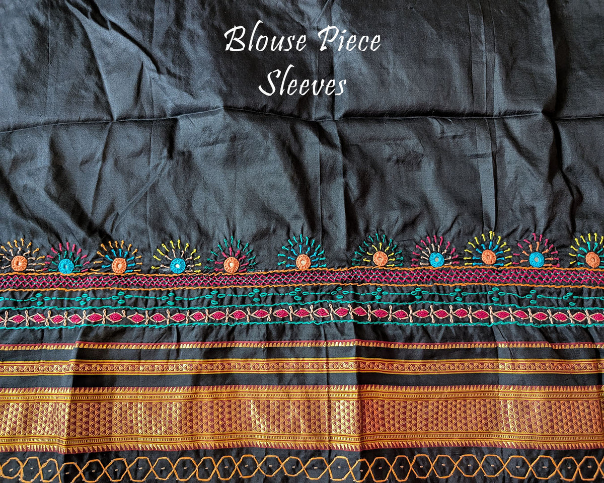 Matching blouse sleeve featuring Lambani embroidery on black fabric