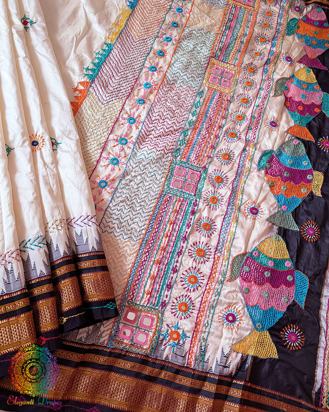Flat lay view of off white pure Ilkal silk saree with Lambani hand embroidery