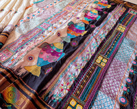 Traditional embroidery motifs on pure Ilkal silk saree with black border