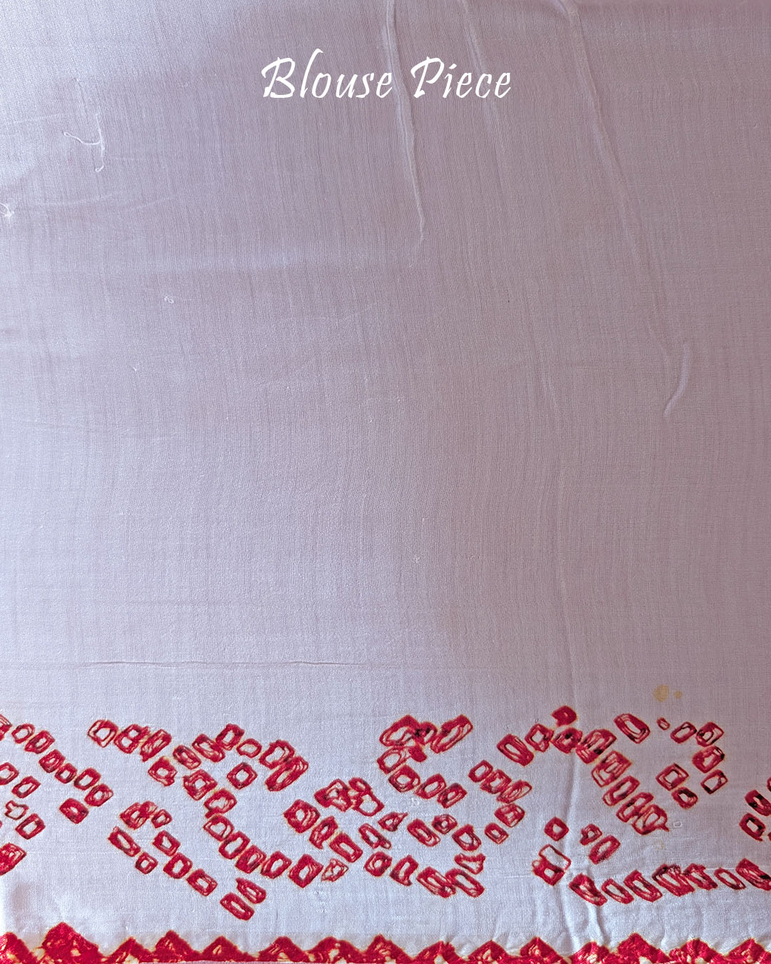 Close-up of the matching blouse sleeve of the Ivory White Gajji Silk Bandhani Saree