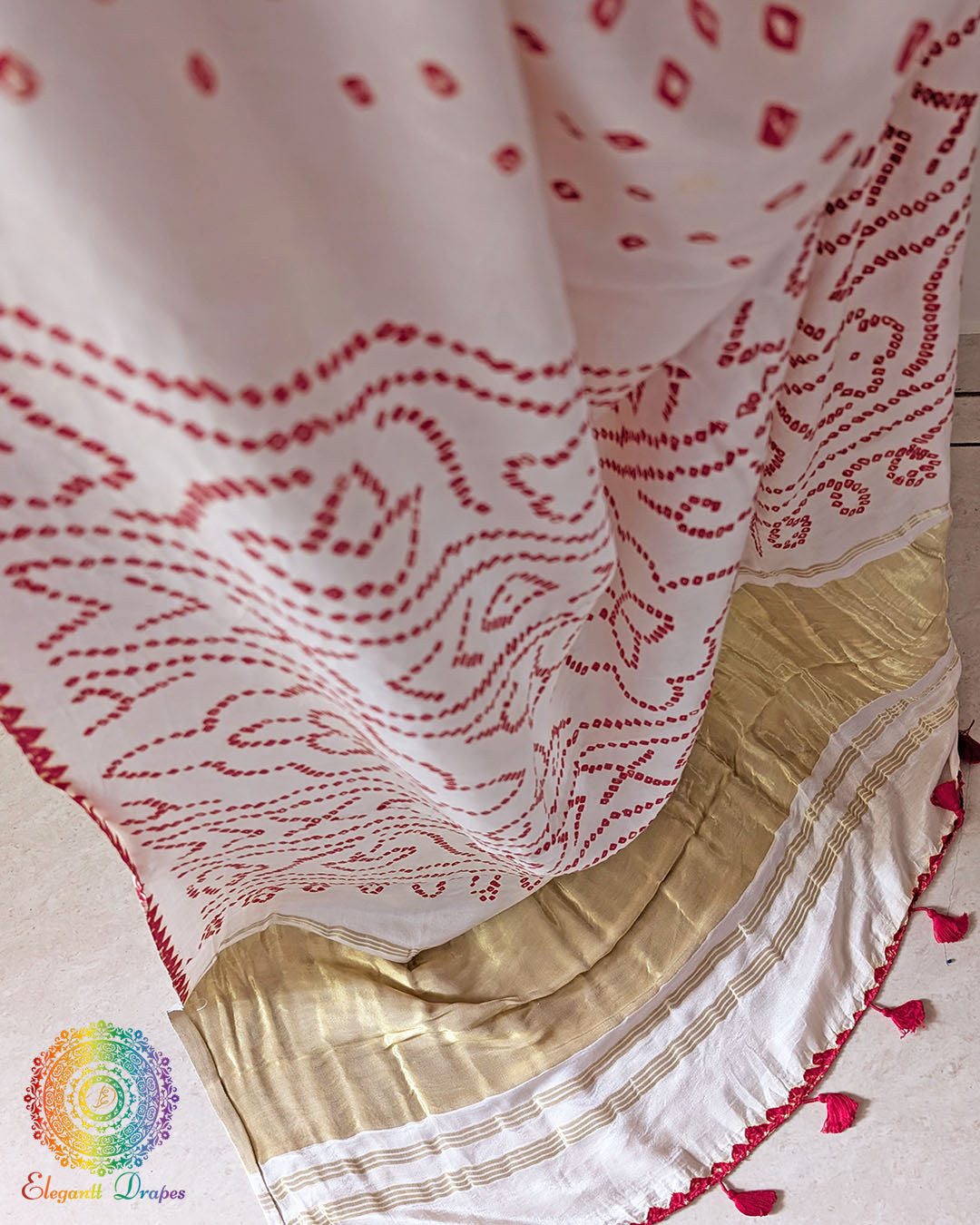 Close-up of traditional Red Bandhani tie-dye on the Ivory White Gajji Silk Saree