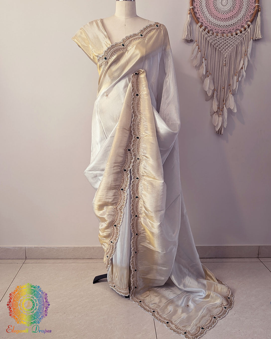 Off white gold soft tissue silk cutdana handwork saree drape view