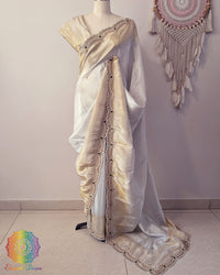 Off white gold soft tissue silk cutdana handwork saree drape view