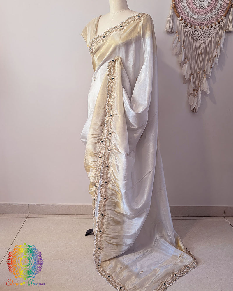 Off white gold soft tissue silk cutdana handwork saree palla drape view