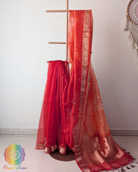 Orange Banarasi Kora Silk Saree folded Pallu drape with Kadhuwa weave