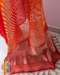 Close-up of Kadhuwa Banarasi Weave and Zari Detailing on Orange Kora Silk Saree