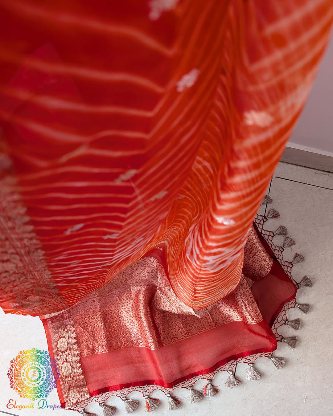 Close-up of Leheriya Pallu and Banarasi Zari Border on Orange Kora Silk Saree