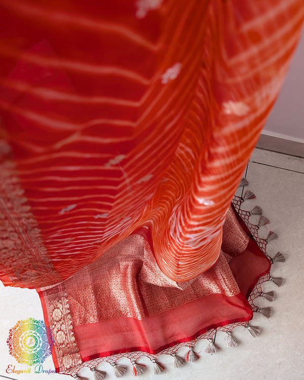 Close-up of Leheriya Pallu and Banarasi Zari Border on Orange Kora Silk Saree