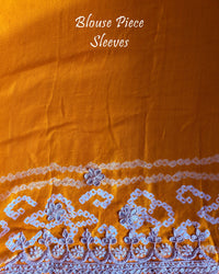 Matching blouse piece in orange gaji silk fabric with gota patti detailing