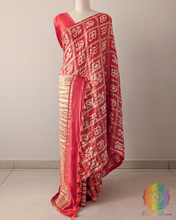 Orange Pure Gaji Silk Bandhani Gharchola Saree in a front drape view, showcasing the vibrant orange colour, traditional Gharchola pattern and rich silk finish.
