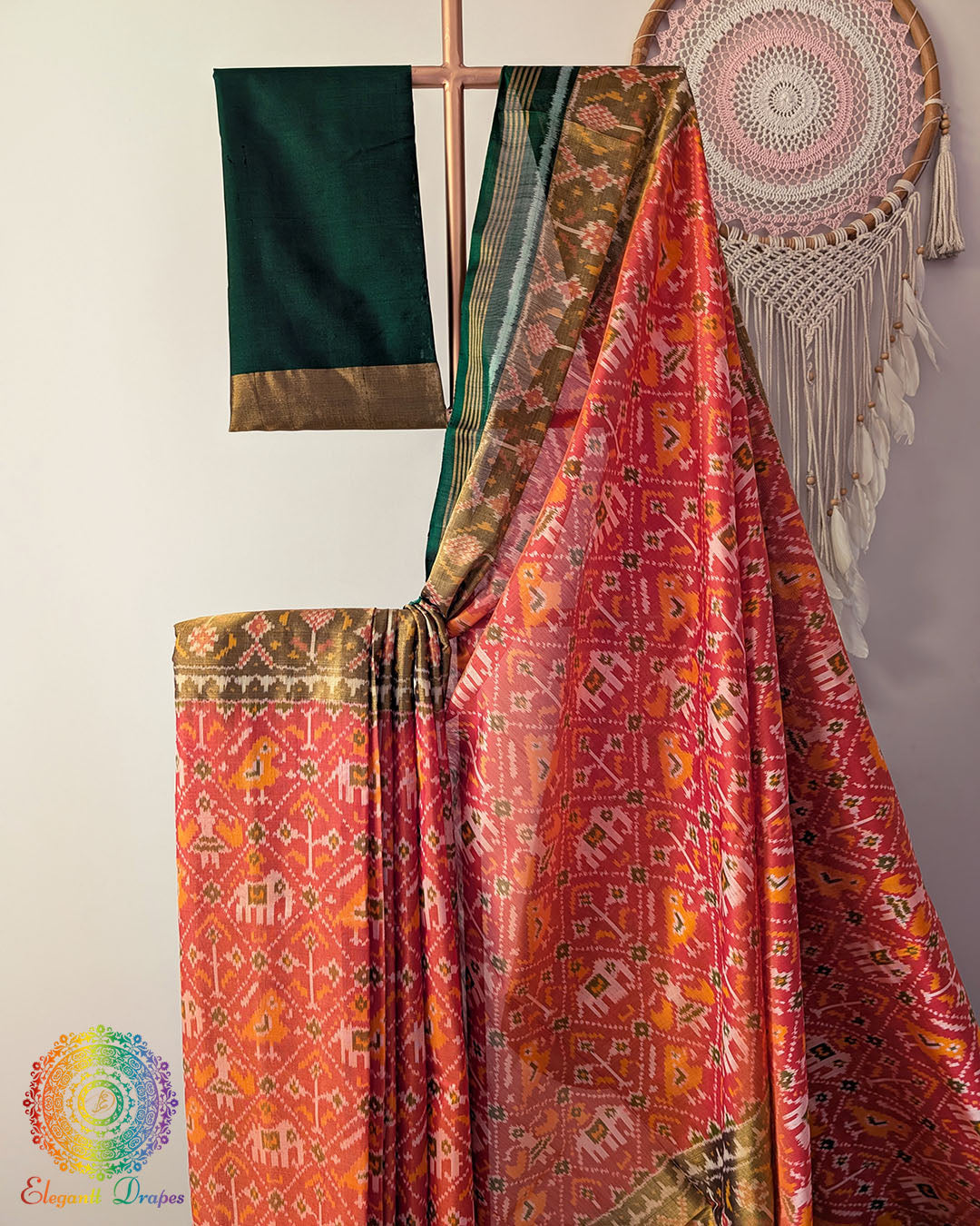 Close up of traditional Rajkot Patola weaving on orange pure mulberry silk saree