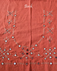 Back view of the Orange Kala Cotton Kutch Mirror Handwork blouse piece, showcasing intricate traditional embroidery and real mirrors arranged in a decorative handcrafted design.