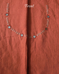 front neck of the Orange Kala Cotton Kutch Mirror Handwork blouse piece, showcasing intricate traditional embroidery and real mirrors arranged in a decorative handcrafted design.