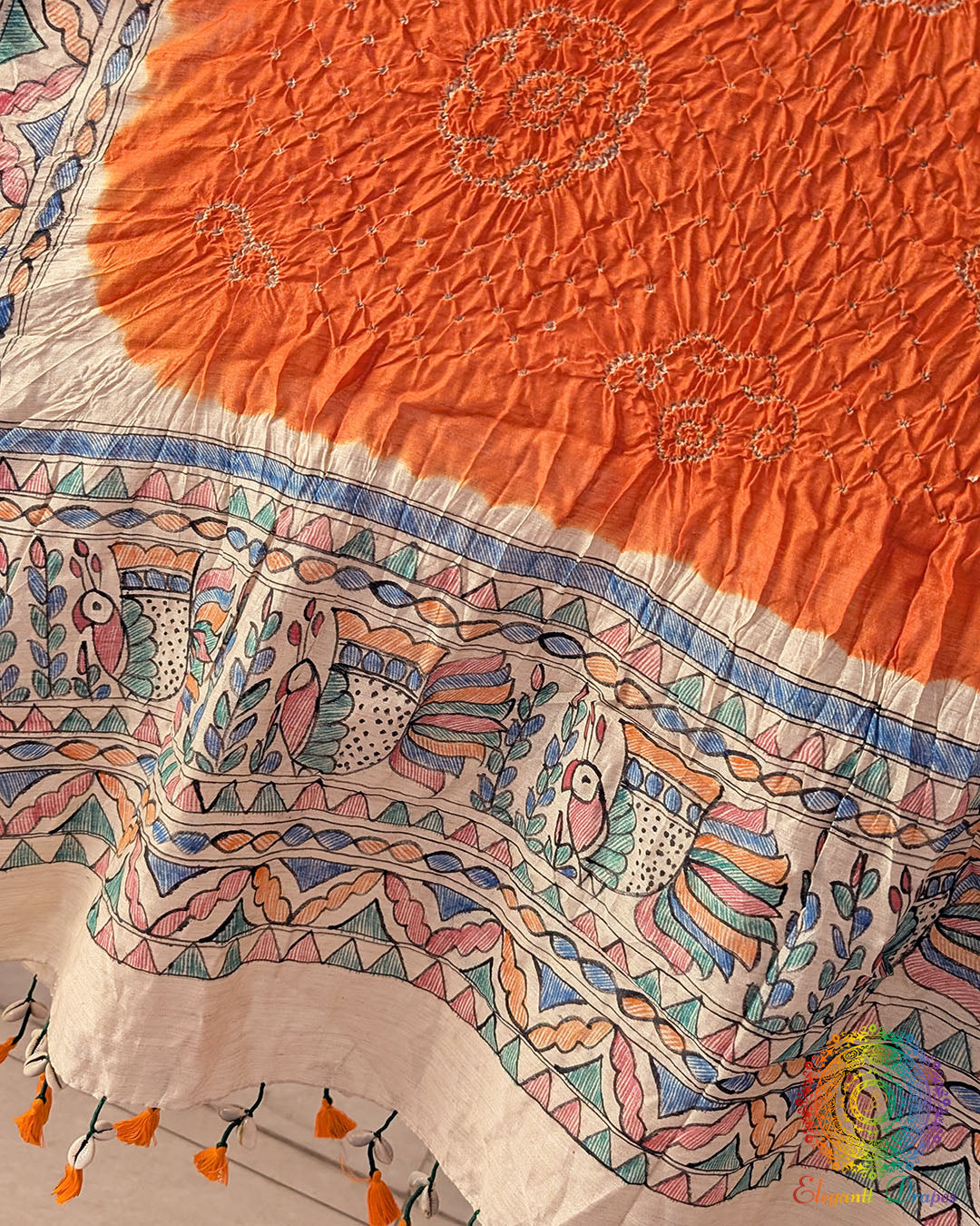Detailed Bandhani pattern on the Orange Muga Silk Dupatta