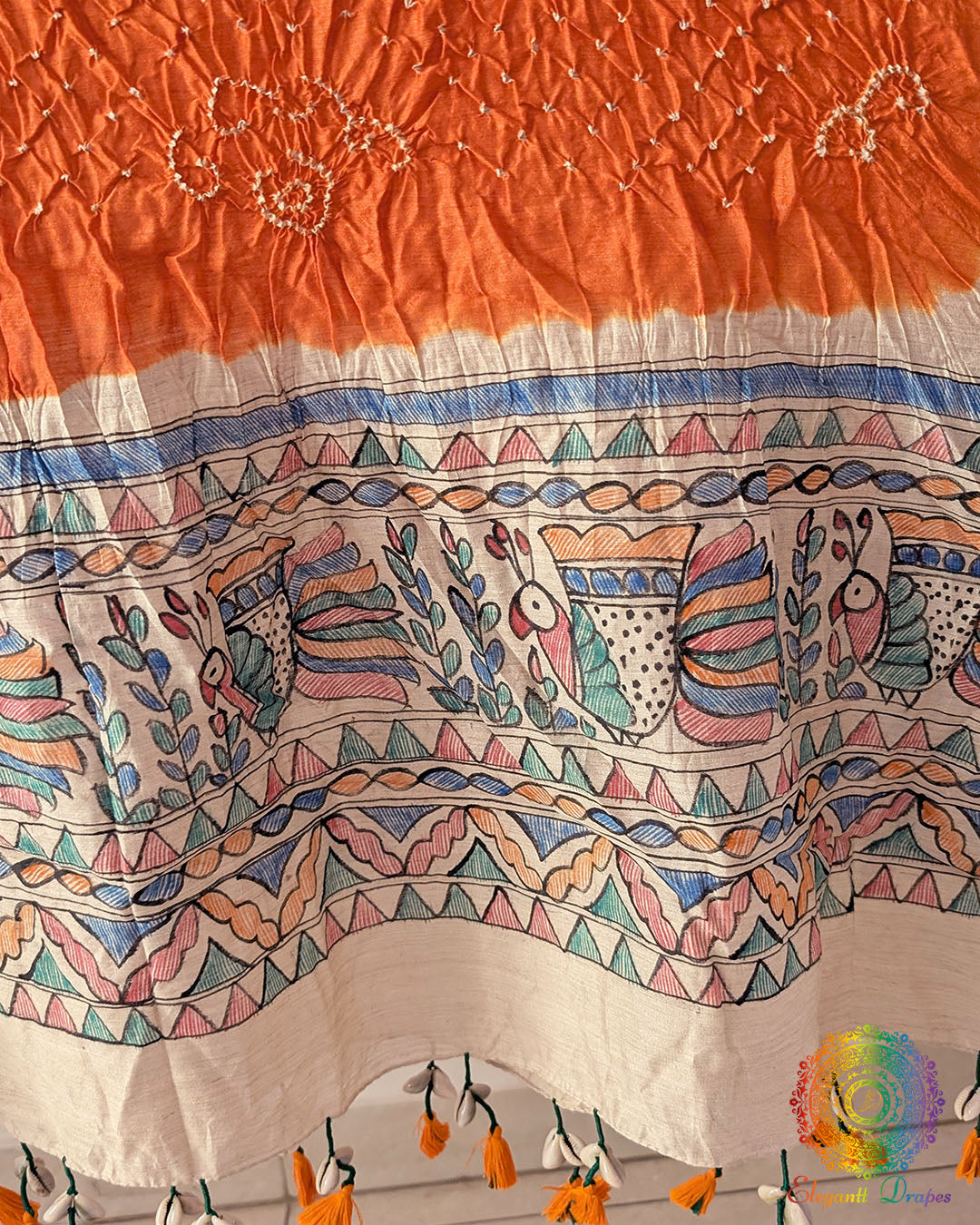 Close-up of the hand-painted Madhubani artwork on the Orange Muga Silk Dupatta