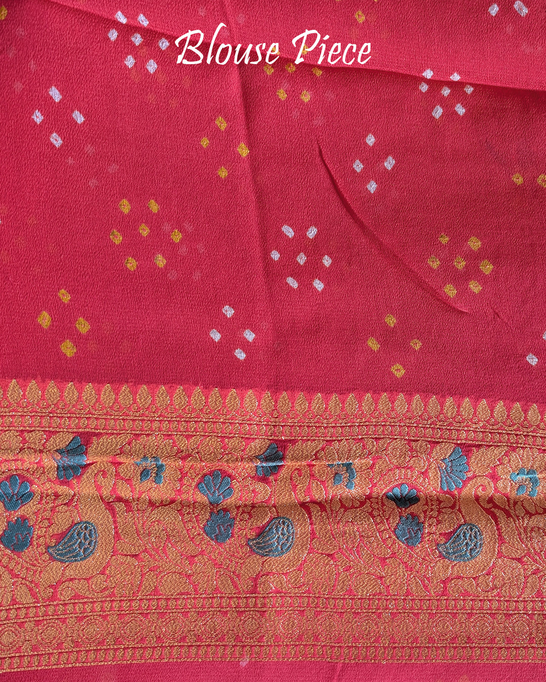 Matching blouse piece in orange peach Banarasi khaddi georgette fabric showing weave detail