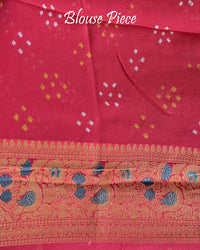 Matching blouse piece in orange peach Banarasi khaddi georgette fabric showing weave detail