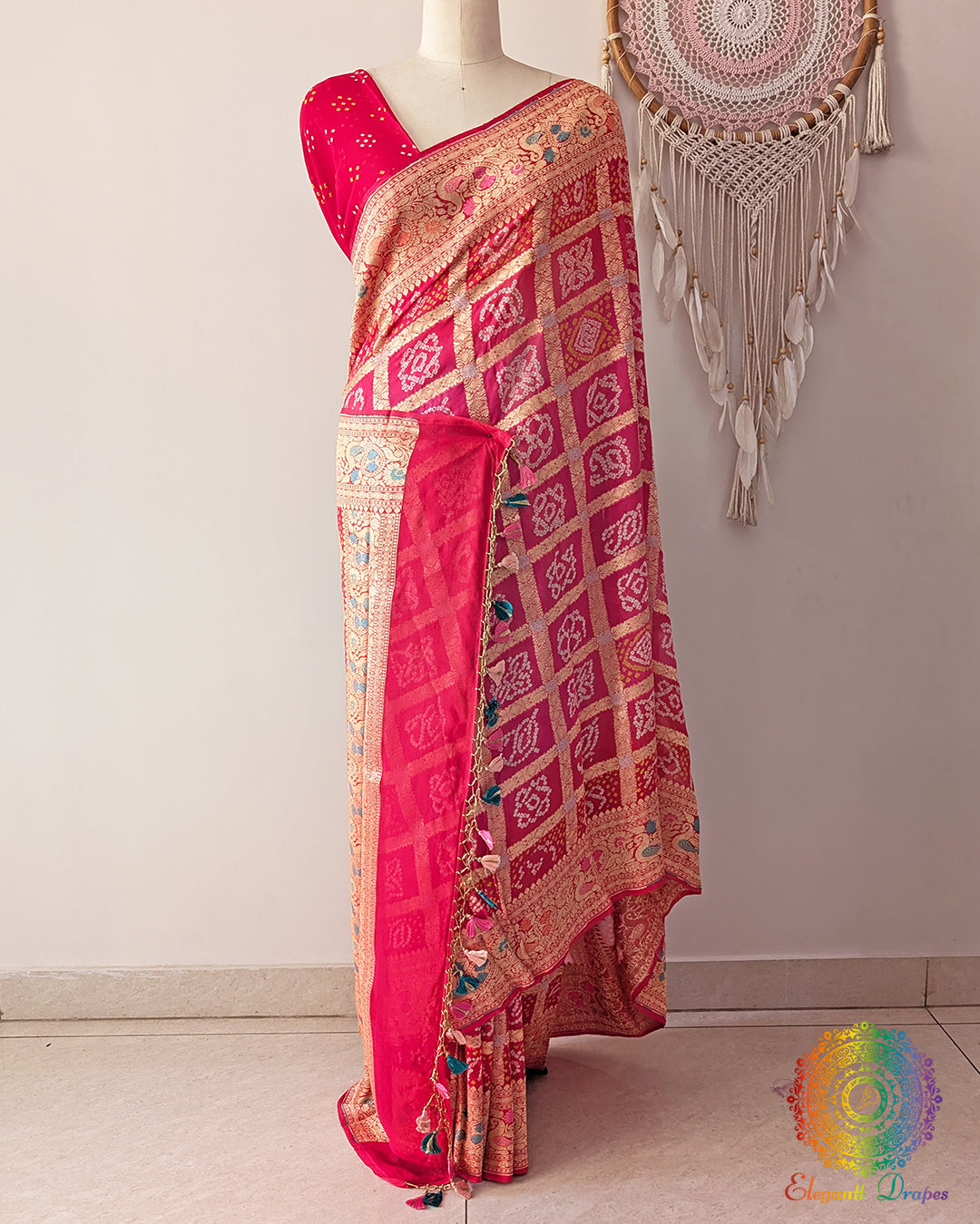 Orange peach Banarasi saree on mannequin showcasing meenakari weave detail