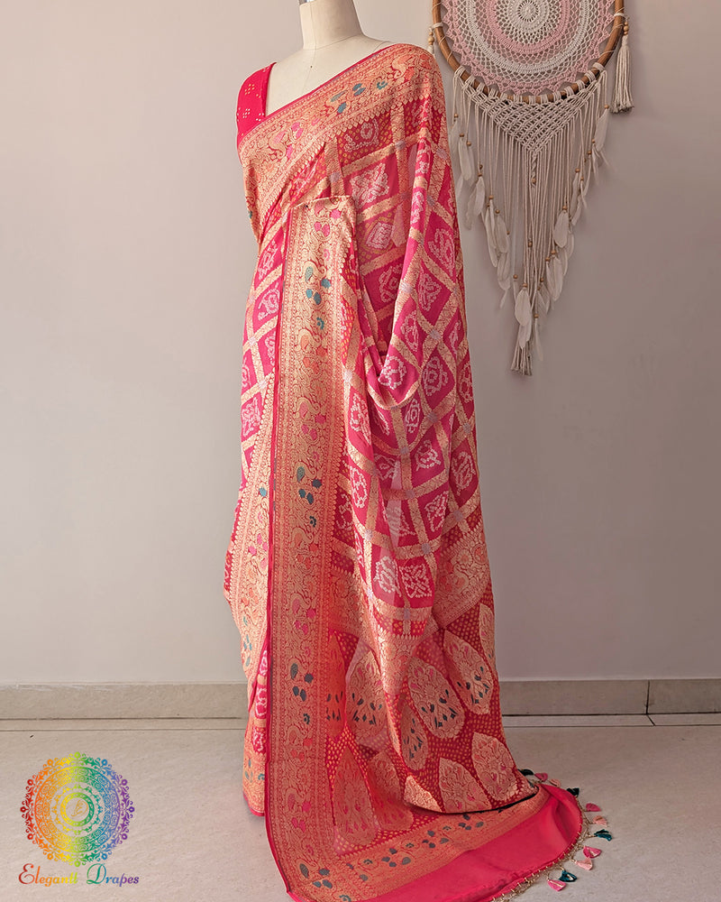 Side angle view of orange peach meenakari bandhani saree highlighting palla fall