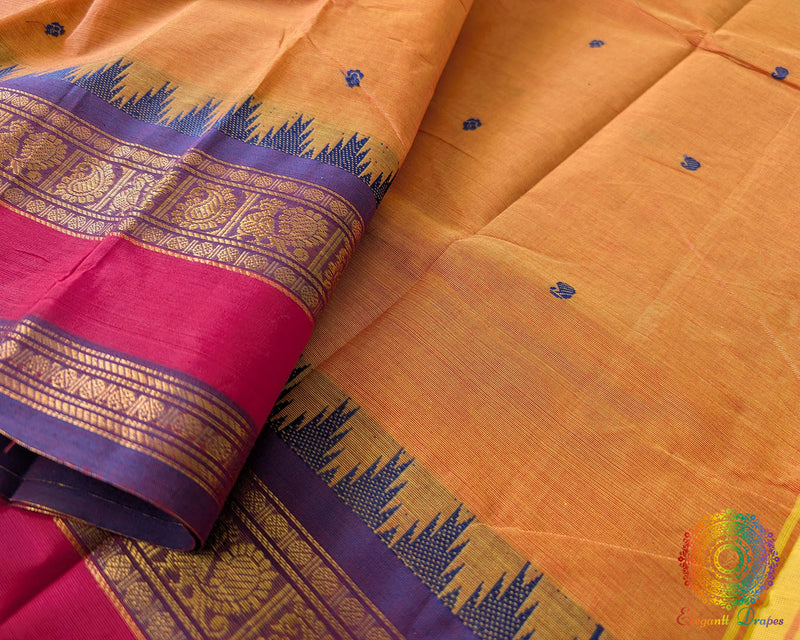 Close up of border on orange Kanchi cotton saree highlighting weave detail