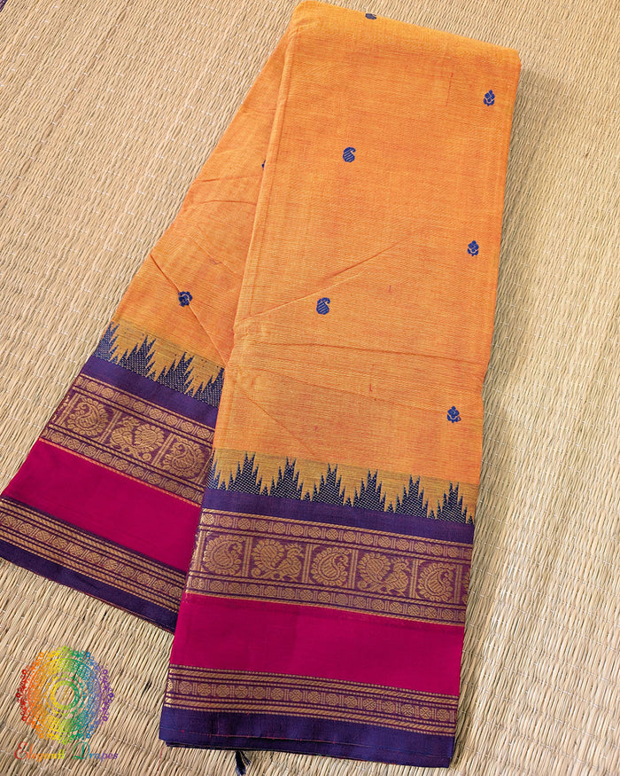 Orange Kanchi cotton saree folded view showing vibrant color and texture