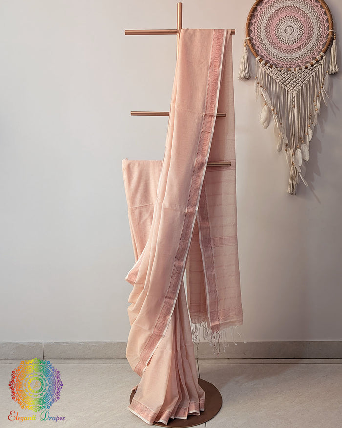 Pale peach Bengal cotton saree with zari border on mannequin showing full drape