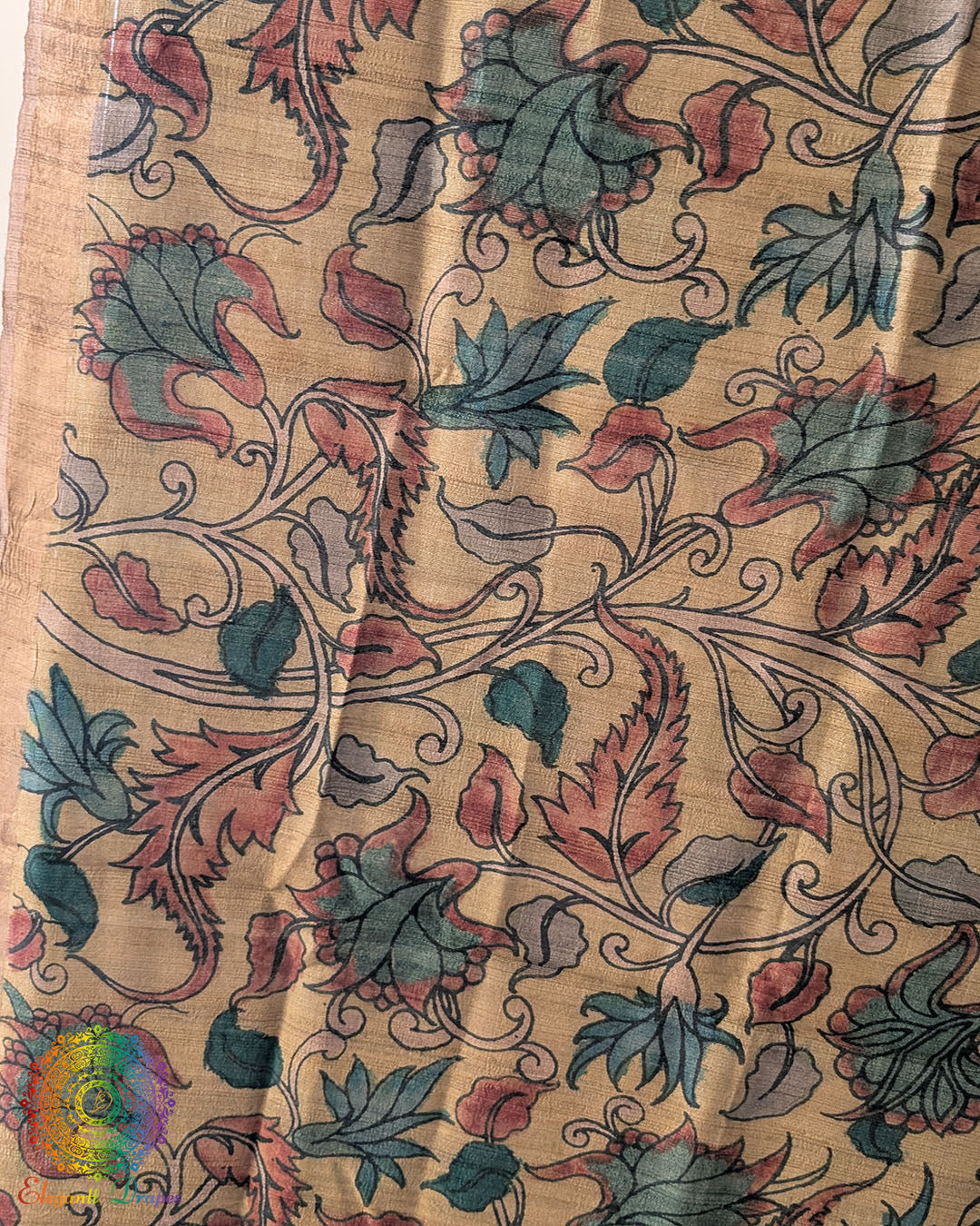 Close-up of authentic hand-painted Kalamkari artwork highlighting the rich texture and natural sheen of Pure Tussar Silk