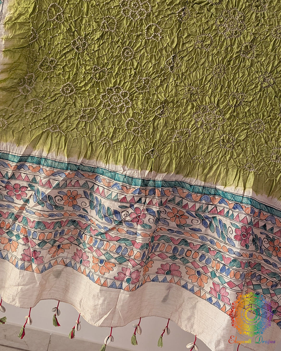 Close-up of the hand-painted Madhubani artwork on the Pastel Green Muga Silk Dupatta