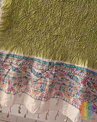 Close-up of the hand-painted Madhubani artwork on the Pastel Green Muga Silk Dupatta