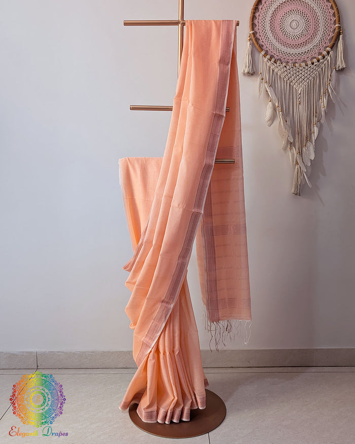 Peach Bengal cotton saree with zari border on mannequin showing full drape