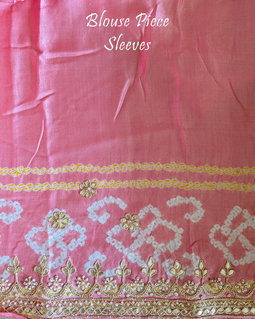 Matching blouse piece in peach gaji silk fabric showing pattern and detailing