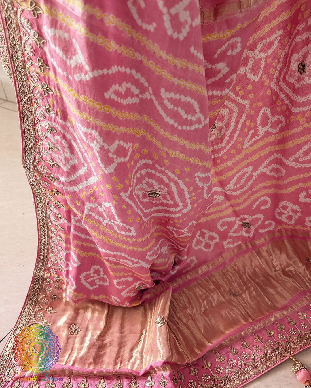 Palla close up on peach gaji silk saree showcasing gota patti work
