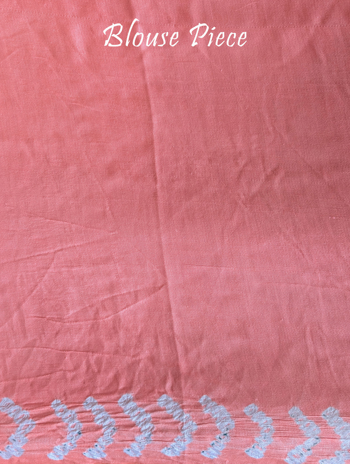 Matching blouse piece in pastel peach gaji silk fabric with bandhani detailing