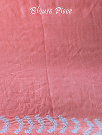 Matching blouse piece in pastel peach gaji silk fabric with bandhani detailing