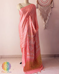 Pastel peach pure gaji silk saree with all-over bandhani dots on mannequin showing full drape