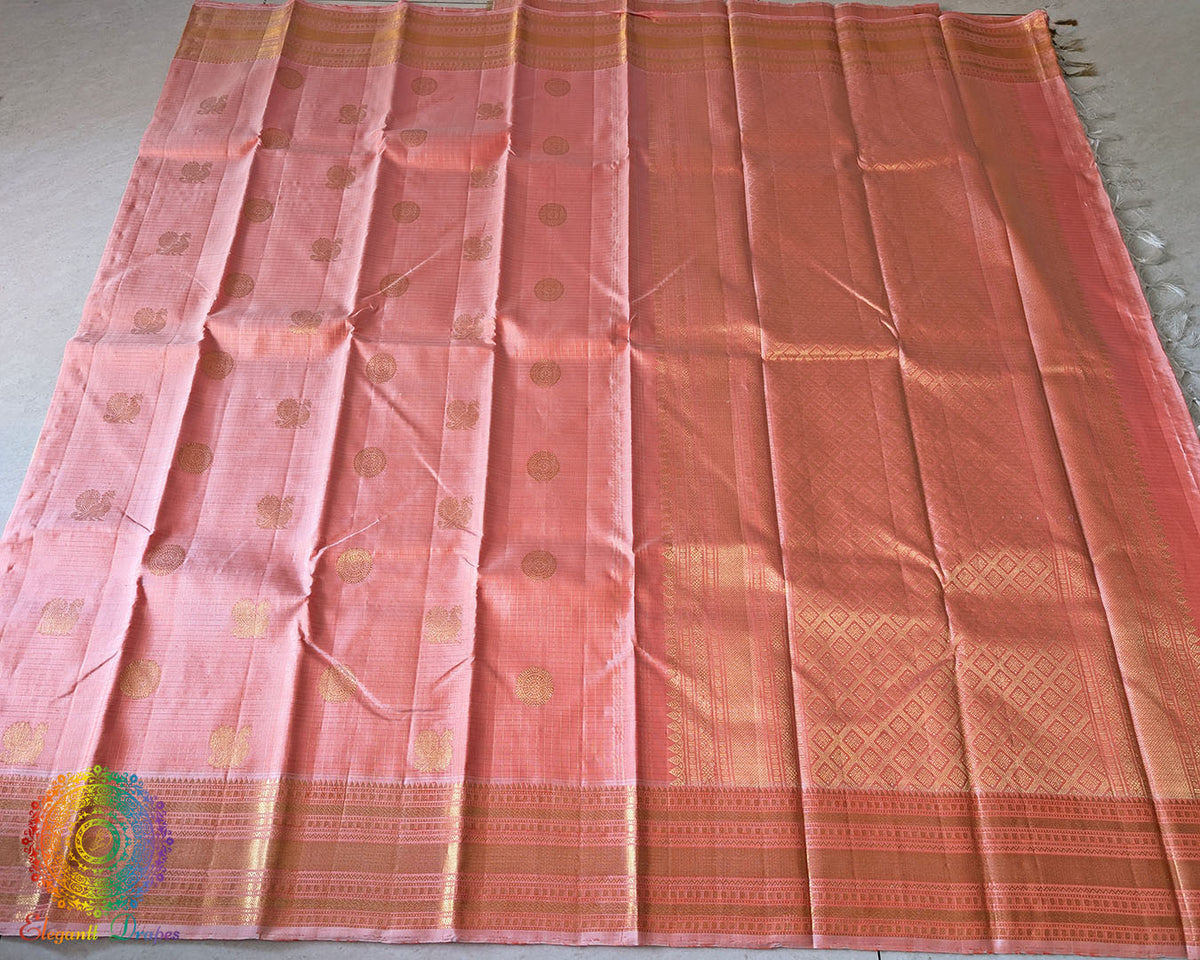 Pastel Peach Pure Kanjivaram Silk Saree with 2-Gram Gold Zari showcasing its elegant drape and luxurious silk texture