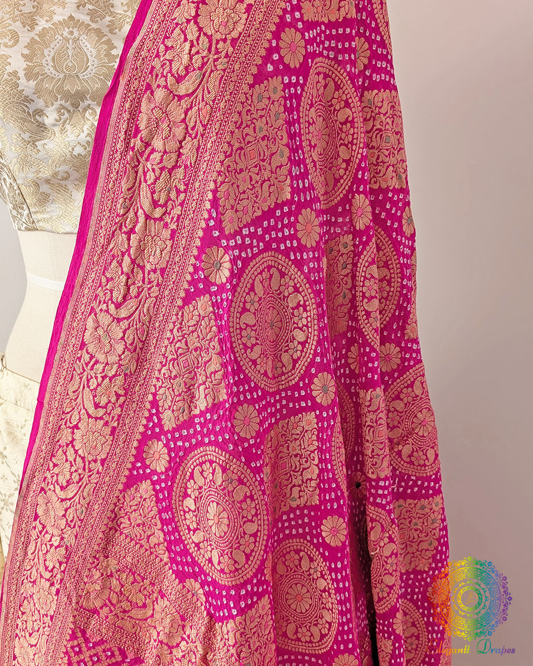 Close up of pink rai bandhej dupatta showing bareek bandhani and meenakari work