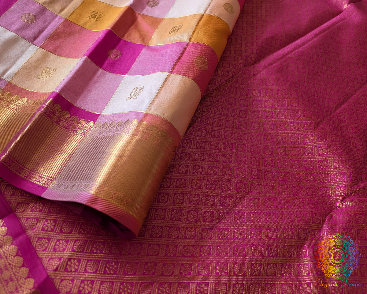 Pleats of the Pink Gold Checked Pure Kanjivaram Silk Saree highlighting the vibrant checked design and graceful silk drape