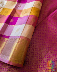 Close-up of the checked silk weave and authentic 2-Gram Gold Zari buttas on the Pink Gold Pure Kanjivaram Silk Saree