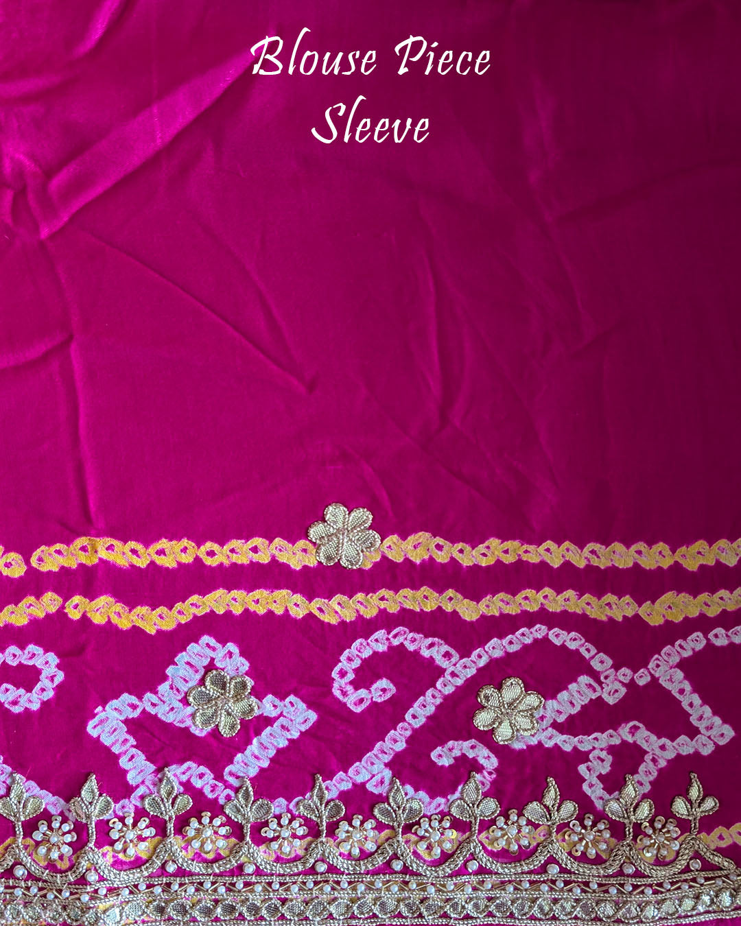 Close-up of the matching blouse sleeve with coordinated Gota Patti detailing