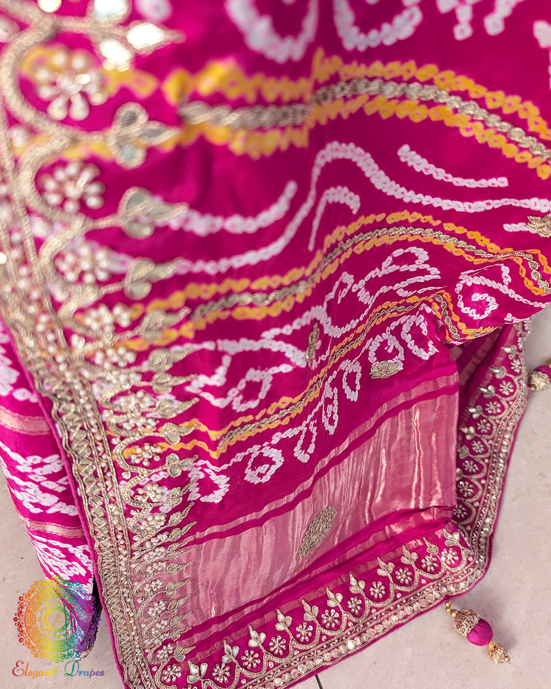 Close-up of intricate Gota Patti handwork on the pallu of the Rani Pink Gharchola Saree