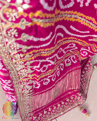 Close-up of intricate Gota Patti handwork on the pallu of the Rani Pink Gharchola Saree