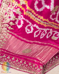 Full pallu view of the Rani Pink Gharchola Saree with traditional Bandhani check pattern