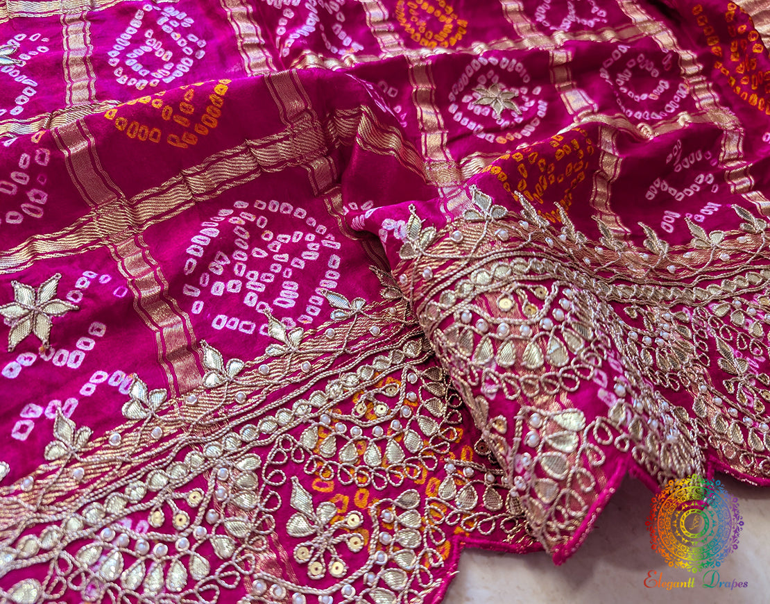Border of rani pink bandhani gaji silk dupatta highlighting gota patti work